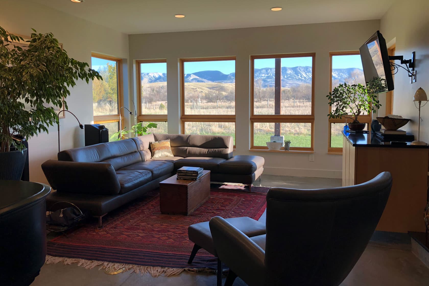 modern-solar-home-design-wyoming Living room with bank of windows